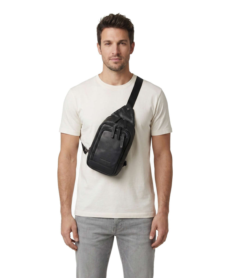 The Chesterfield Brand Cow Wax Pull Up Riga Sling bag black